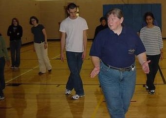 Lorraine (in blue shirt) teaches a dance